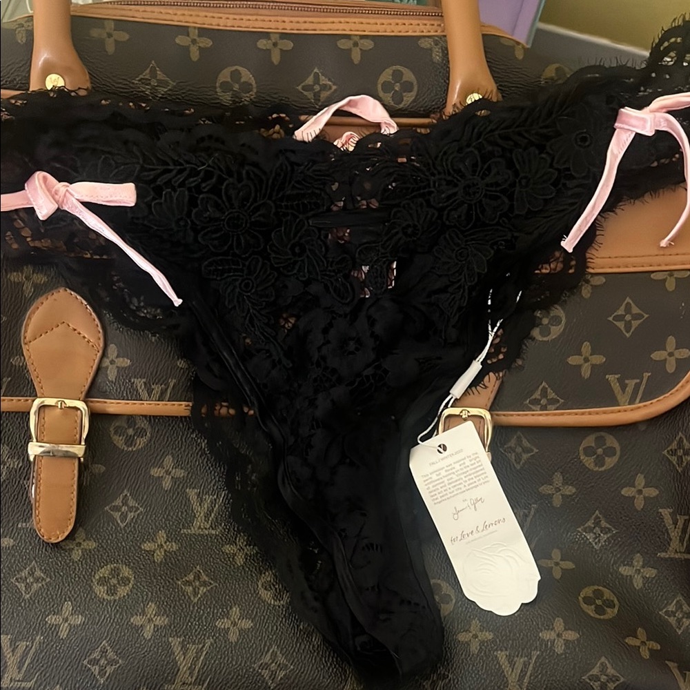 Elegant Black Lace Thong with Pink Accents